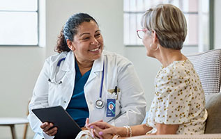 woman doctor in white coat meeting with patient